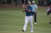 Min Woo Lee reacts as he walks toward the 18th green during the final round of The Players Championship golf tournament, Sunday, March 12, 2023, in Ponte Vedra Beach, Fla. (AP Photo/Charlie Neibergall)