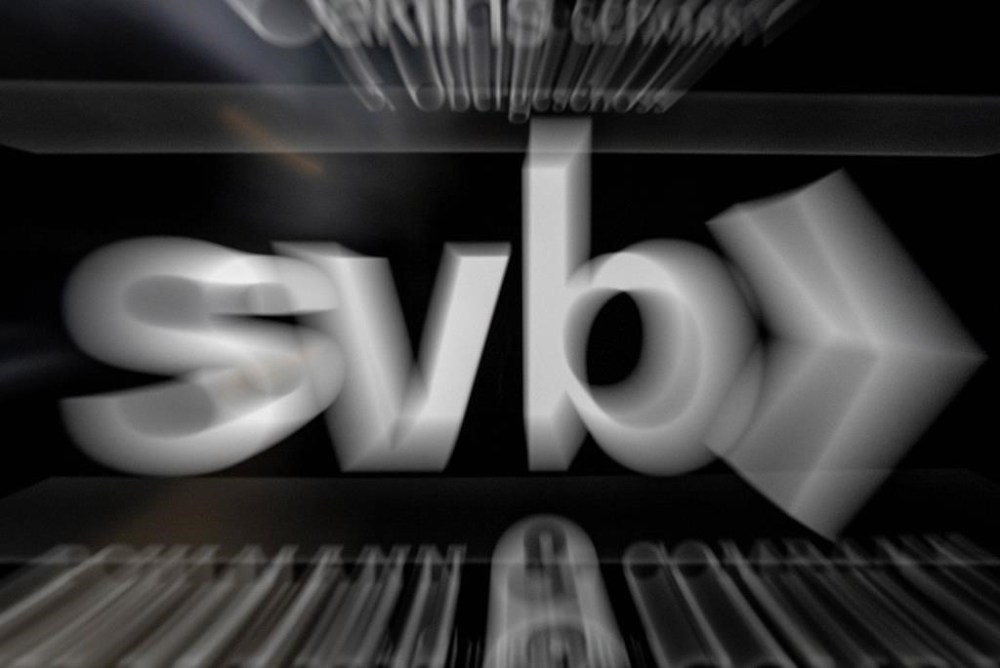 A sign of a branch of the Silicon Valley Bank is pictured at an office building where the bank is located in Frankfurt, Germany, Monday, March 13, 2023. (AP Photo/Michael Probst)