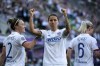 FILE - Dzsenifer Marozsan of Lyon, center, celebrates the opening goal during the women's soccer Champions League final match between Olympique Lyon and FC Barcelona at the Groupama Arena in Budapest, May 18, 2019. Marozsan on Monday, March 13, 2023 says she is retiring from international soccer before this year’s Women’s World Cup because she is still feeling the effects of a serious knee injury. The 30-year-old midfielder scored the winning goal in the 2016 Olympic final as Germany beat Sweden 2-1. (Balazs Czagany/MTI via AP, file)