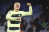 Manchester City's Erling Haaland celebrates their victory at the English Premier League soccer match between Crystal Palace and Manchester City at Selhurst Park stadium, in London, Saturday, March 11, 2023. (AP Photo/David Cliff)