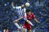 Hertha's Marco Richter, left, and Mainz's Jae-Sung Lee battle for the ball during the German Bundesliga match between Hertha BSC Berlin and FSV Mainz 05 in Berlin, Germany, Saturday, March 11, 2023. (Soeren Stache/dpa via AP)