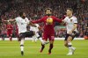 Liverpool's Mohamed Salah, centre, tries to hold off Manchester United's Diogo Dalot, right, and Fred during the English Premier League soccer match between Liverpool and Manchester United at Anfield in Liverpool, England, Sunday, March 5, 2023. (AP Photo/Jon Super)