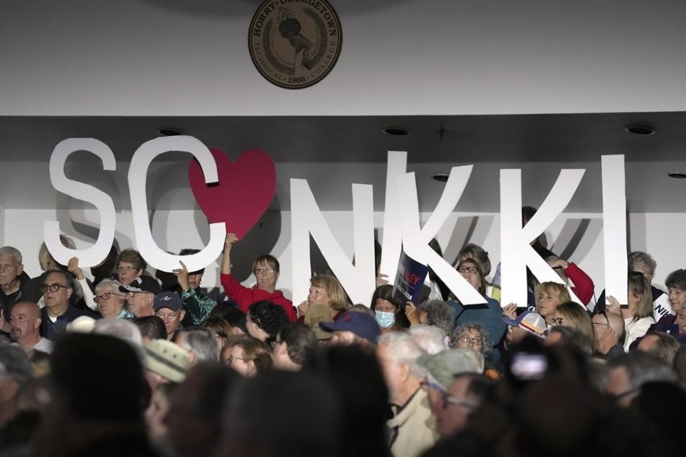 Supporters wait for South Carolina Gov. Nikki Haley, a candidate for the 2024 Republican presidential nomination, to speak during a campaign rally on Monday, March 13, 2023, in Myrtle Beach, S.C. (AP Photo/Meg Kinnard)