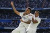 Real Madrid's Eder Militao, left, celebrates with his teammate Rodrygo after he scored his side's second goalduring a Spanish La Liga soccer match between Real Madrid and Espanyol at the Santiago Bernabeu stadium in Madrid, Spain, Saturday, March 11, 2023. (AP Photo/Bernat Armangue)