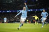 Manchester City's Erling Haaland celebrates after scoring his side's 5th goal during the Champions League round of 16 second leg soccer match between Manchester City and RB Leipzig at the Etihad stadium in Manchester, England, Tuesday, March 14, 2023. (AP Photo/Dave Thompson)
