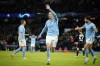 Manchester City's Erling Haaland shows five with his hand after he scored his 5th goal, the 6-0, during the Champions League round of 16 second leg soccer match between Manchester City and RB Leipzig at the Etihad stadium in Manchester, England, Tuesday, March 14, 2023. (AP Photo/Dave Thompson)