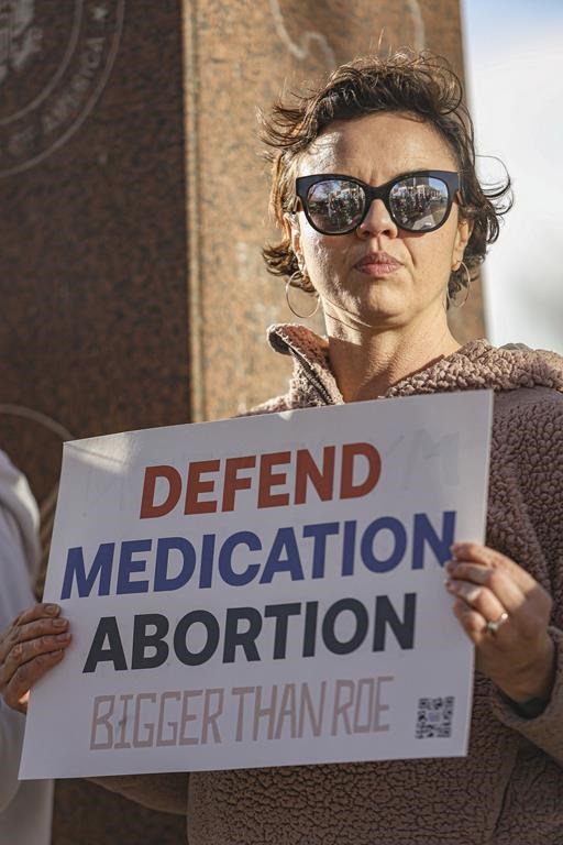 Lindsey London stands in protest in front of Federal Court Building in support of access to abortion medication outside the Federal Courthouse on Wednesday, March 15, 2023 in Amarillo, Texas. A conservative federal judge heard arguments Wednesday from a Christian group seeking to overturn the Food and Drug Administration’s more than 2-decade-old approval of an abortion medication, in a case that could threaten the most common form of abortion in the U.S. (AP Photo/David Erickson)