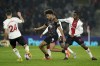 Brentford's Kevin Schade, centre, battles for the ball with Southampton's Ibrahima Diallo, right and Mohamed Elyounoussi, during the English Premier League soccer match between Southampton and Brentford at St Mary's Stadium in Southampton, England, Wednesday March 15, 2023. (Adam Davy/PA via AP)