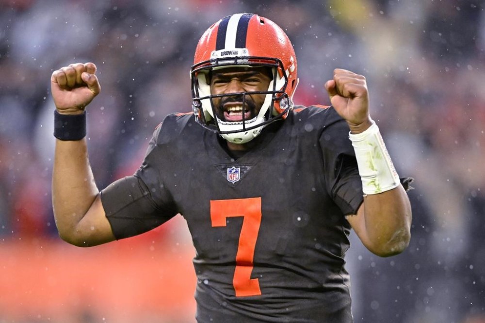 FILE -Cleveland Browns quarterback Jacoby Brissett (7) celebrates after handing the ball off to running back Nick Chubb, who scored in overtime of the team's NFL football game against the Tampa Bay Buccaneers in Cleveland, Sunday, Nov. 27, 2022. Jacoby Brissett has agreed to terms with the Washington Commanders on a one-year contract worth $10 million with $8 million guaranteed, according to a person with knowledge of the deal. The person spoke to The Associated Press on condition of anonymity Wednesday, March 15, 2023 because the team had not announced the contract.(AP Photo/David Richard, File)