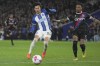 Brighton's Kaoru Mitoma, left, challenges for the ball with Crystal Palace's Nathaniel Clyne during the Premier League soccer match between Brighton and Hove Albion and Crystal Palace at the American Express Community Stadium in Brighton, England, Wednesday, March 15, 2023. (AP Photo/Kin Cheung)
