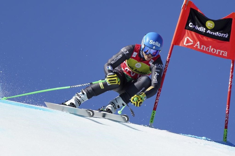 Italy's Elena Curtoni speeds down the course during an alpine ski, women's World Cup super-g race, in Soldeu, Andorra, Thursday, March 16, 2023. (AP Photo/Giovanni Zenoni)