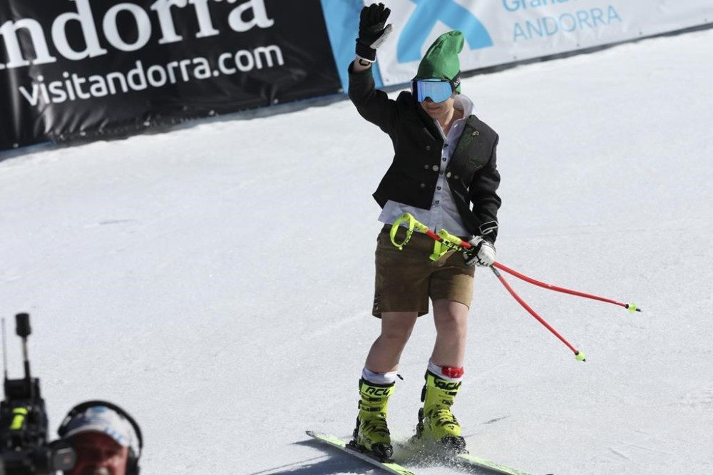 Austria's Nicole Schmidhofer waves at the finish area of an alpine ski, women's World Cup super-g race, in Soldeu, Andorra, Thursday, March 16, 2023. (AP Photo/Alessandro Trovati)