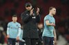 FILE - Burnley's manager Vincent Kompany applauds his teams fans after the end of the English League Cup 4th round soccer match against Manchester United, at Old Trafford in Manchester, England, Dec. 21, 2022. On Saturday, March 18, 2023 City fans can catch a view of the real-life Kompany when he returns to the Etihad. He is back as manager of second-division Burnley and will attempt to eliminate City from the FA Cup. (AP Photo/Dave Thompson, File)