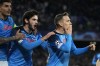 Napoli's Piotr Zielinski , right, celebrates after he scored is side's third goal during the Champions League round of 16 second leg soccer match between SSC Napoli and Eintracht Frankfurt at the Diego Armando Maradona stadium in Naples, Italy, Wednesday, March 15, 2023. (AP Photo/Gregorio Borgia)