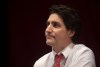 Prime Minister Justin Trudeau looks on at a town hall meeting at the Amphitheatre at the Eastlink Events Centre in Clarenville, N.L, Wednesday, March 15, 2023. Trudeau and other leaders react across the country after two officers were killed in the line of duty, in Edmonton on Thursday. THE CANADIAN PRESS/Paul Daly