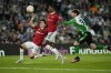 Manchester United's Marcus Rashford, center, is followed by Betis' Juan Miranda during the Europa League round of 16 second leg soccer match between Real Betis and Manchester United at the Benito Villamarin stadium in Seville, Spain, Thursday, March 16, 2023. (AP Photo/Jose Breton)