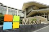FILE - In this July 3, 2014, file photo, the Microsoft Corp. logo is displayed outside the Microsoft Visitor Center in Redmond, Wash. Microsoft is infusing generative AI tools into its Office software, including Word, Excel and Outlook emails. The company said Thursday, March 16, 2023 the new feature, named Copilot, is a processing engine that will allow users to do things like summarize long emails, draft stories in Word and animate slides in PowerPoint. (AP Photo/Ted S. Warren, File)