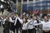 Youth take part in an action to mark the ninth anniversary of the Crimea annexation from Ukraine with the banner reads: 