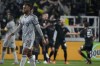 CF Montreal forward Mason Toye (13) walks across the pitch as Nashville SC players behind him celebrate a goal in the second half of an MLS soccer game, Saturday, March 11, 2023, in Nashville, Tenn. After an extended time away that included two weeks of training camp in Florida and three Major League Soccer road games, CF Montreal will finally be playing in front of a home crowd. THE CANADIAN PRESS/AP/Mark Humphrey