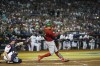 Mexico'sJoey Meneses, right, hits a three-run home run against the United States during the fourth inning of a World Baseball Classic game in Phoenix, Sunday, March 12, 2023. (AP Photo/Godofredo A. Vásquez)