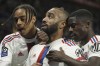 Lyon's Alexandre Lacazette, centre, celebrates with his teammates after scoring his side's opening goal during the French League One soccer match between Lyon and Nantes at the Groupama stadium, in Decines, near Lyon, France, Friday, March 17, 2023. (AP Photo/Laurent Cipriani)