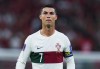 FILE - Portugal's Cristiano Ronaldo pauses during the World Cup quarterfinal soccer match between Morocco and Portugal in Doha, Qatar, Dec. 10, 2022. New Portugal coach Roberto Martínez included Cristiano Ronaldo on his first squad list since taking over from Fernando Santos following the World Cup on Friday, March 17, 2023. (AP Photo/Petr David Josek, File)