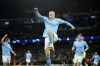 Manchester City's Erling Haaland celebrates after scoring his side's 5th goal during the Champions League round of 16 second leg soccer match between Manchester City and RB Leipzig at the Etihad stadium in Manchester, England, Tuesday, March 14, 2023. (AP Photo/Dave Thompson)