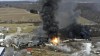 FILE - This photo taken with a drone shows portions of a Norfolk and Southern freight train that derailed Friday night in East Palestine, Ohio are still on fire at mid-day Saturday, Feb. 4, 2023. Soon after the train derailed and spilled toxic chemicals in Ohio last month, anonymous pro-Russian accounts started spreading misleading claims and anti-American propaganda about it on Twitter, using Elon Musk's new verification system to expand their reach while creating the illusion of credibility. (AP Photo/Gene J. Puskar, File)