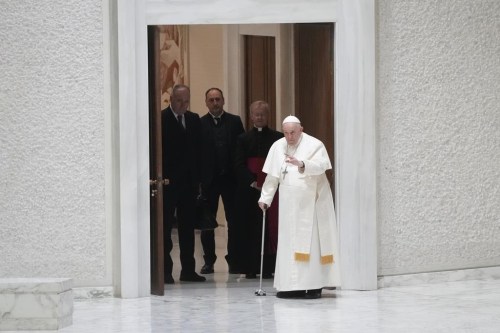 Pope Francis arrives in the Paul VI hall to meet with refugee families at the Vatican, Saturday, March 18, 2023. (AP Photo/Gregorio Borgia)