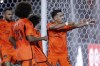 Houston Dynamo midfielder Amine Bassi, right, mimics a bow and arrow as he celebrates his goal on a penalty kick against Austin FC during the second half of an MLS soccer match Saturday, March 18, 2023, in Houston. (AP Photo/Michael Wyke)