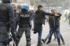 Roma fans riot with police ahead the Italian Serie A soccer match between Lazio and Roma at Rome's Olympic stadium, Sunday, March 19, 2023. (AP Photo/Gregorio Borgia)