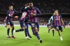 Barcelona's Franck Kessie, centre, celebrates with teammates after scoring his team's second goal during the Spanish La Liga soccer match between Barcelona and Real Madrid at Camp Nou stadium in Barcelona, Spain, Sunday, March 19, 2023. (AP Photo/Joan Mateu)
