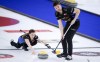 Team Walker/Muyres skip Laura Walker, left, makes a shot as third Kirk Muyres sweeps while they play Team Einarson/Gushue at the Canadian Mixed Doubles Curling Championship in Calgary, Alta., Wednesday, March 24, 2021. When Muyres decided to shift from men's team curling to mixed doubles, the upcoming Canadian championship was one of the top events circled on his calendar. THE CANADIAN PRESS/Jeff McIntosh