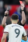Fulham's Aleksandar Mitrovic is shown red card during the English FA Cup quarterfinal soccer match between Manchester United and Fulham at the Old Trafford stadium in Manchester, England, Sunday, March 19, 2023. (AP Photo/Jon Super)