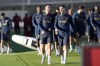 Portugal's Cristiano Ronaldo, left, talks with former Manchester United teammate Diogo Dalot as they arrive on the pitch for a Portugal soccer team training session in Oeiras, outside Lisbon, Tuesday, March 21, 2023. Portugal will play Liechtenstein Thursday in a Euro 2024 qualifying match in Lisbon, the first game under the new team head coach Roberto Martinez. (AP Photo/Armando Franca)