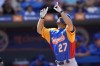 Venezuela's Jose Altuve (27) crosses the plate to score on a solo home run during the second inning of an exhibition baseball game against the New York Mets, Thursday, March 9, 2023, in Port St. Lucie, Fla. (AP Photo/Lynne Sladky)