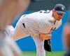 FILE - In this June 9, 2007, file photo, New York Yankees' Roger Clemens delivers a pitch in the first inning against the Pittsburgh Pirates in an interleague baseball game at Yankee Stadium in New York. Roger Clemens will be an analyst for ESPN during the March 30, 2023 opener when the defending World Series champion Houston Astros host the Chicago White Sox.. (AP Photo/Kathy Willens, File)