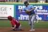 Tampa Bay Rays second baseman Charlie Culberson forces Philadelphia Phillies' Bryson Stott (5) at second base and relays the throw to first in time to turn a double play on Rhys Hoskins during the first inning of a spring training baseball game Tuesday, March 7, 2023, in Clearwater, Fla. (AP Photo/Chris O'Meara)