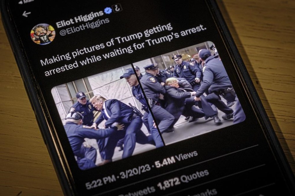 Images created by Eliot Higgins with the use of artificial intelligence show a fictitious skirmish with Donald Trump and New York City police officers posted on Higgins' Twitter account, as photographed on an iPhone in Arlington, Va., Thursday, Mar. 23, 2023. The highly detailed, sensational images, which are not real, were produced using a sophisticated and widely accessible image generator. (AP Photo/J. David Ake)