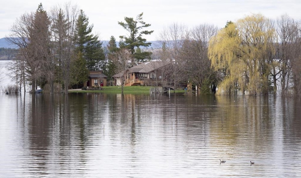 A home off of Beachburg Road by the Ottawa River in Whitewater Region, east of Pembroke, Ontario is completely surrounded by water as flooding continues in the region, on Saturday, May 11, 2019. Community organizations and municipalities in Ontario could get a piece of $110 million in funding the province has committed over three years for emergency readiness.THE CANADIAN PRESS/Justin Tang