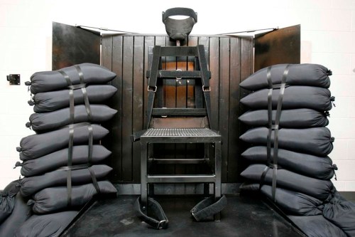 FILE - A chair sits in the execution chamber at the Utah State Prison on June 18, 2010, after Ronnie Lee Gardner was executed by firing squad in Draper, Utah. Idaho lawmakers passed a bill on March 20, 2023, that would authorize the use of firing squads if the state is unable to obtain drugs required for its lethal injection program. The bill will head to the desk of Idaho Gov. Brad Little next. (Trent Nelson/The Salt Lake Tribune via AP, Pool, File)