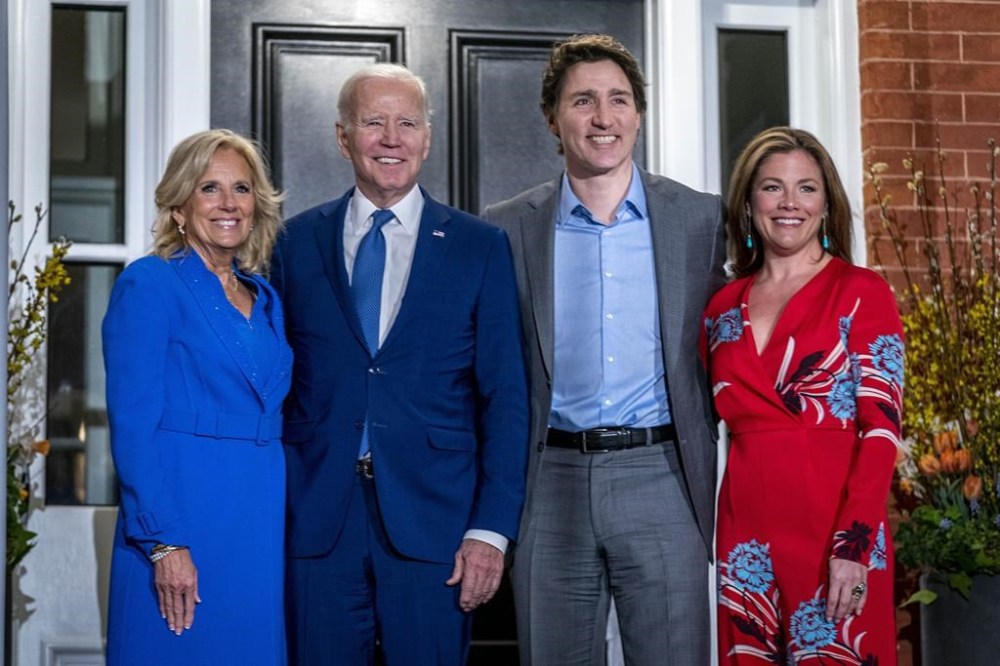 U.S. President Joe Biden and first lady Jill Biden pose for members of the media as they arrive to visit with Prime Minister Justin Trudeau and his wife Sophie Gregoire Trudeau at Rideau Cottage, Thursday, March 23, 2023, in Ottawa. THE CANADIAN PRESS/AP-Andrew Harnik