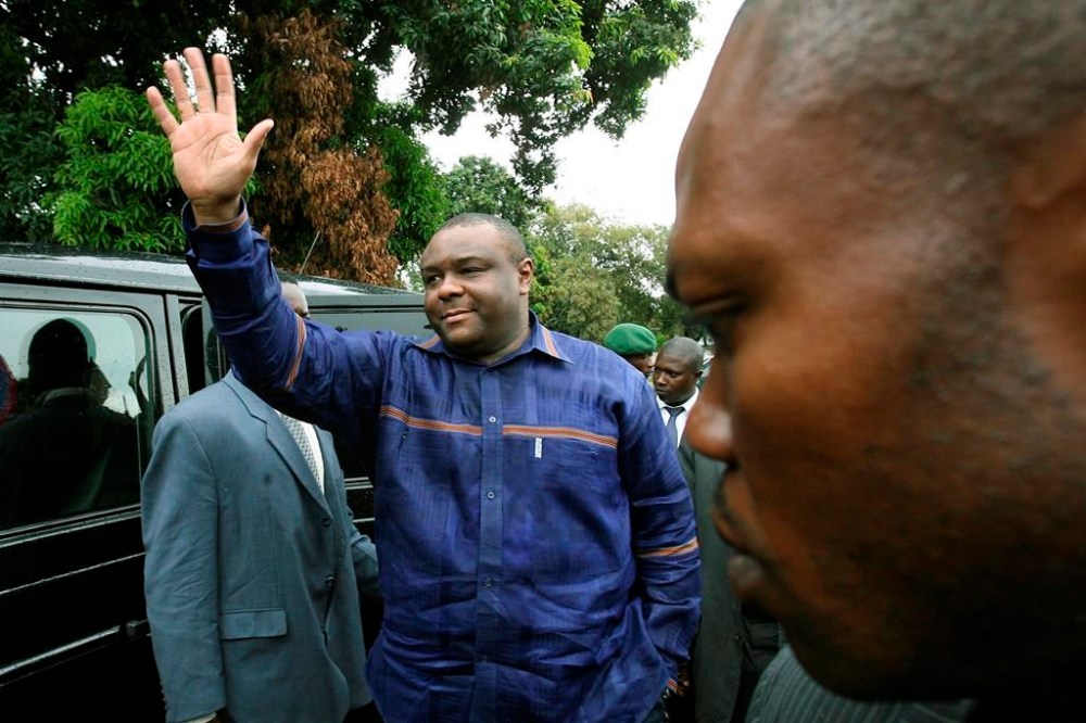 FILE- Former militia leader Jean Pierre Bemba waves at supporters as he arrives at a polling station to cast his ballot in the presidential elections in Kinshasa, Congo, Oct. 29, 2006. Bemba was appointed as Congo's defense minister Thursday March 23, 2023, amid a cabinet reshuffle. (AP Photo/Jerome Delay, file)