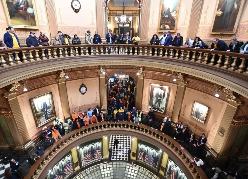 FILE - Union members and supporters chant in the Capitol rotunda, Tuesday morning, March 14, 2023, as they wait for a Right To Work bill to be voted on. Michigan, long known as a mainstay of organized labor, became the first state in decades to repeal a union-restricting law known as “right-to-work” that was passed over a decade ago by a Republican-controlled Legislature. (Todd McInturf/Detroit News via AP)