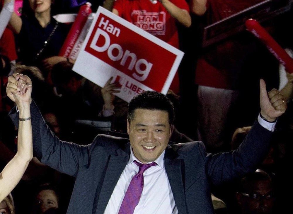 Then-Provincial Liberal candidate Han Dong celebrates with supporters while taking part in a nomination event, in Toronto, Thursday, May 22, 2014. THE CANADIAN PRESS/Nathan Denette
