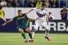 LA Galaxy forward Dejan Joveljic, left, defends against Vancouver Whitecaps defender Ranko Veselinovic during the first half of an MLS soccer match in Carson, Calif., Saturday, March 18, 2023. THE CANADIAN PRESS/AP-Ringo H.W. Chiu
