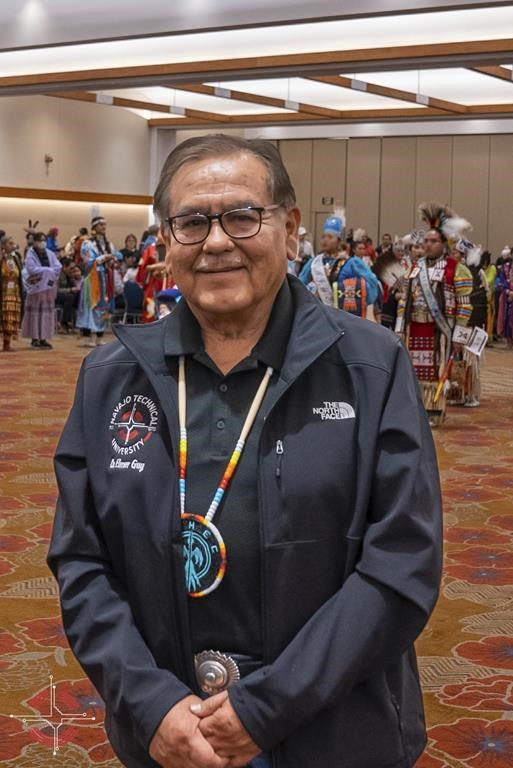 In this photo provided by Navajo Technical University, university President Elmer Guy poses during a higher education conference in Albuquerque, N.M., March 8, 2023. On Friday, March 24, 2023, school officials said the creation of a doctoral program focused on Dine culture and language marks a milestone for the university and is the first doctoral program among tribal colleges and universities in the United States. (Wafa Hozien/Navajo Technical University via AP)