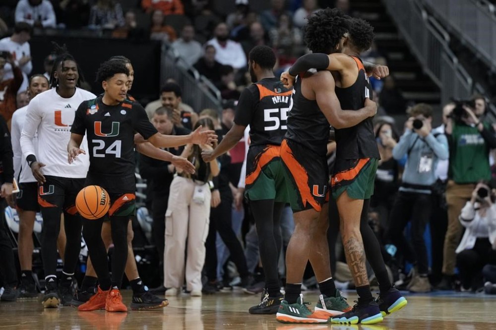 Miami celebrates after their win against Houston in a Sweet 16 college basketball game in the Midwest Regional of the NCAA Tournament Friday, March 24, 2023, in Kansas City, Mo. (AP Photo/Jeff Roberson)