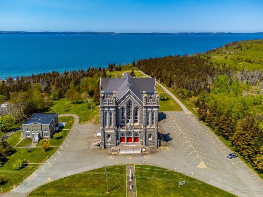 An aerial photo of St. Bernard Roman Catholic Church in St. Bernard, N.S., on the province’s southwestern coast, is seen in an undated handout photo. The deconsecrated church is being sold for an asking price of $250,000, though it will require extensive repairs, says the former church treasurer, Suzanne Lefort. THE CANADIAN PRESS/HO-Travis Baker, *MANDATORY CREDIT*