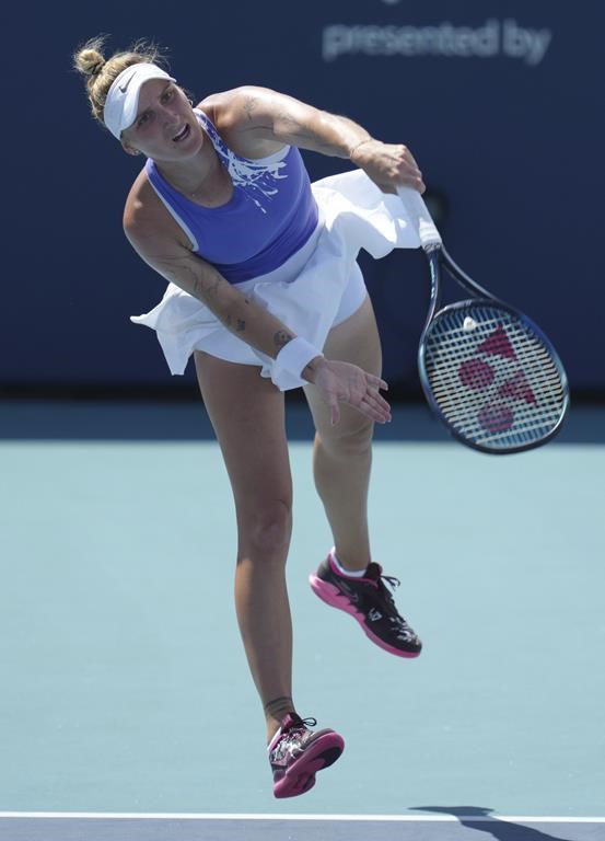 Marketa Vondrousova, of the Czech Republic, serves against Karolina Pliskova, of the Czech Republic, at the Miami Open tennis tournament, Sunday, March 26, 2023, in Miami Gardens, Fla. (AP Photo/Jim Rassol)